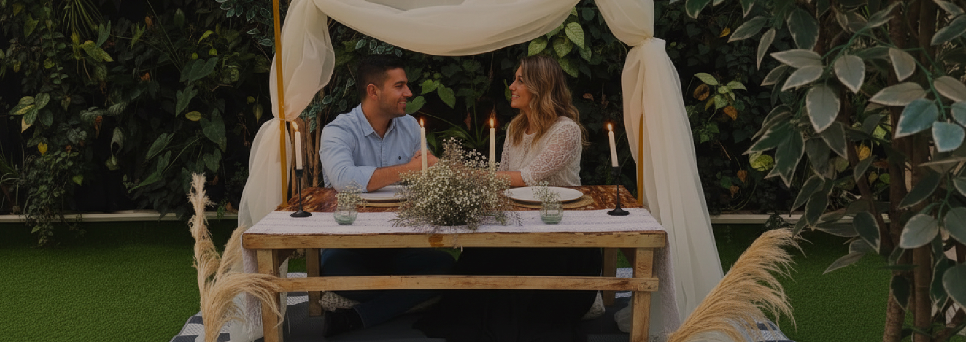 Chris standing up holding his daughter Elva